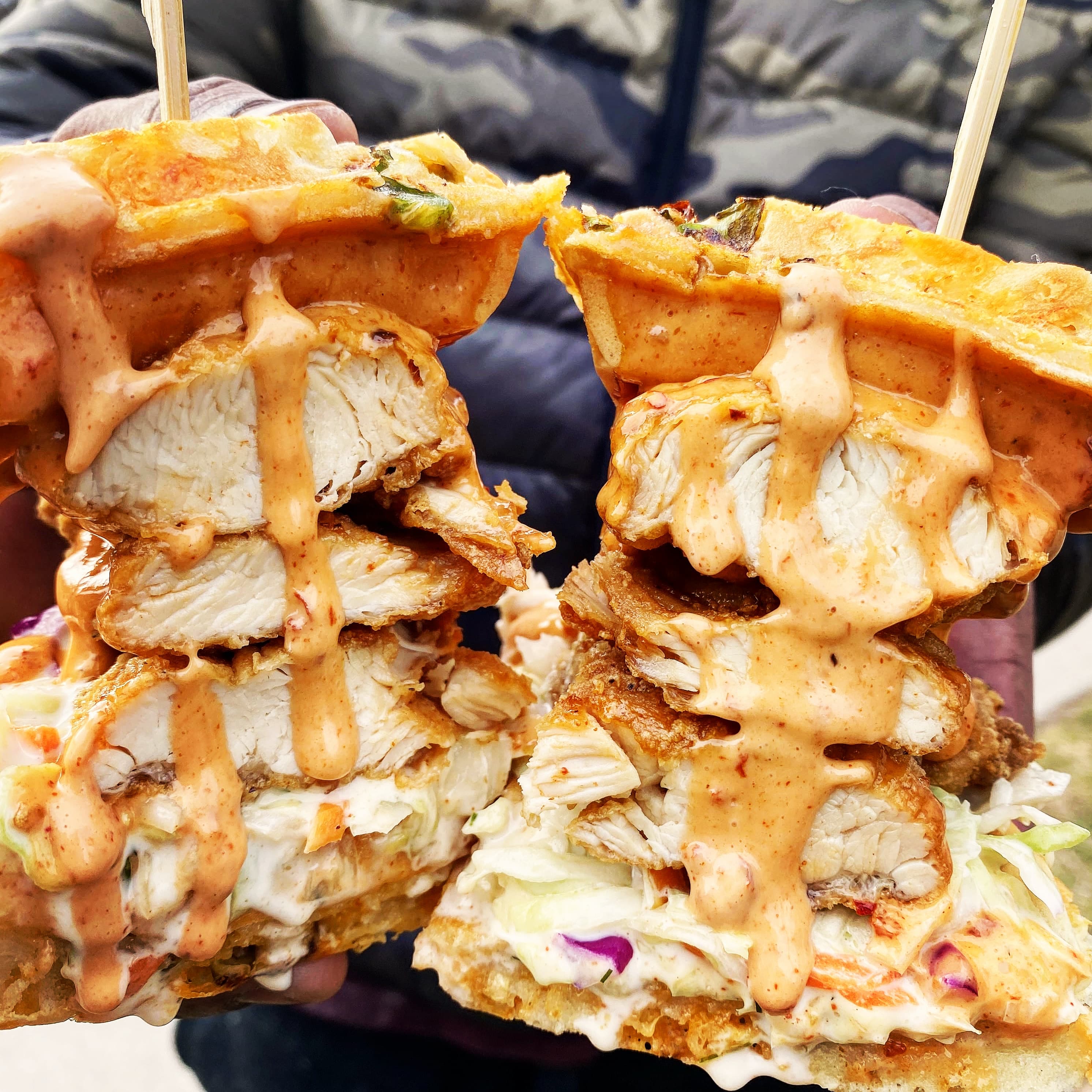 The Cluck Yeah — crunchy chicken on a jalapeño-cheddar waffle with coleslaw, chipotle aioli, and dill mayo.